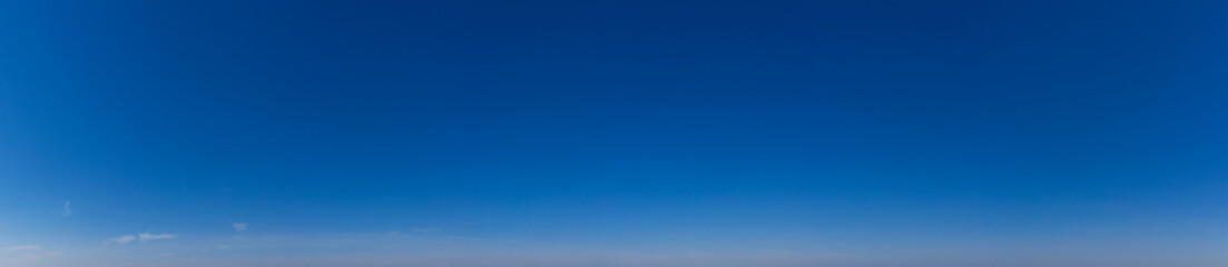 Blue Sky background with tiny Clouds. Panorama background