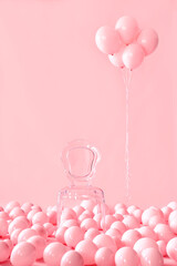 Empty transparent chair on pink pastel background among pink air balloons