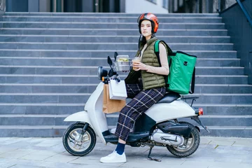 Foto op Plexiglas Food delivery service, female rider on motorbike delivering food to clients with scooter. Concepts about fast transportation, food delivery and technology. © Iryna