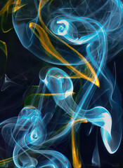 Abstract colorful smoke against a black background