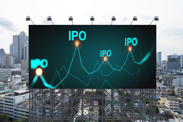 IPO icon hologram on road billboard over day time panorama city view of Bangkok. The hub of initial...