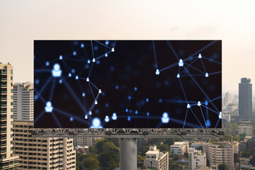 Glowing Social media icons on road billboard over panoramic city view of Bangkok, Southeast Asia. The concept of networking and establishing new connections between people and businesses.