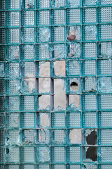 Backround of broken window. Destructive behaviour of people