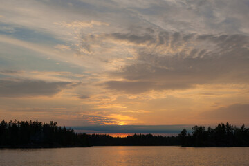 Fototapeta na wymiar sunset over forest lake