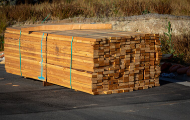 Lumber stacked at a housing construction site