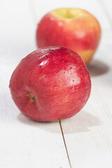 Apple put on wooden timber board,