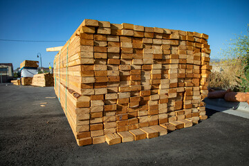 Lumber stacked at a housing construction site