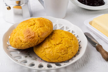 Broa, typical brazilian corn flour bread with butter, jam and coffee