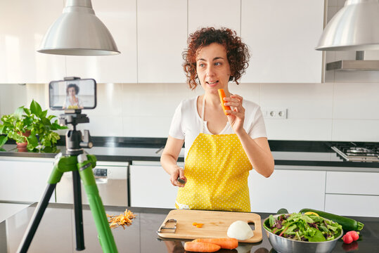 Young blogger and online influencer recording video content on healthy food