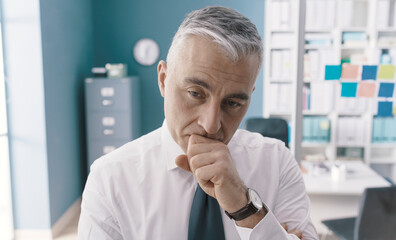 Pensive businessman taking a decision