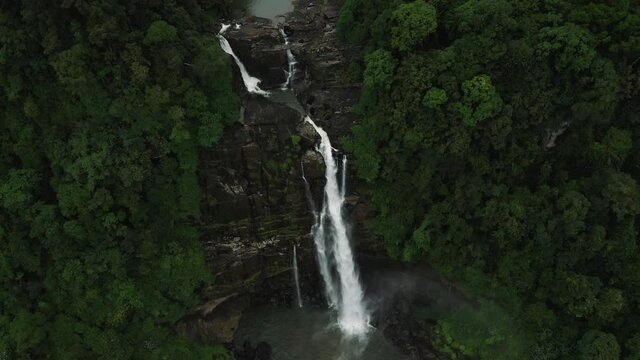 Rising above scenic Aberdeen waterfall in lush rainforest of Sri Lanka