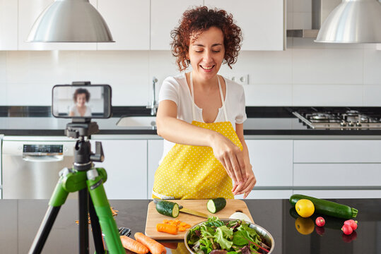 Young blogger and online influencer recording video content on healthy food