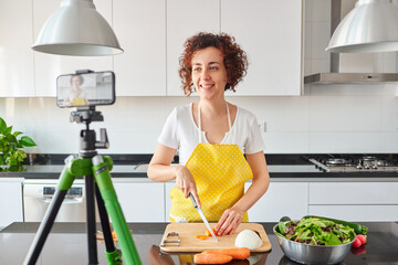 Young blogger and online influencer recording video content on healthy food