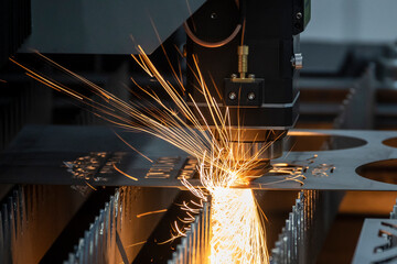 The fiber laser cutting machine cutting  machine cut the metal plate. The hi-technology sheet metal manufacturing process by laser cutting machine.