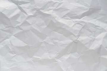 White crumpled paper texture background.