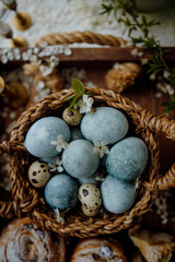 Fototapeta na wymiar eggs painted blue. Easter eggs top view. chicken and quail eggs in a basket.
