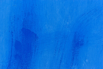 Background of iron painted with blue paint with streaks