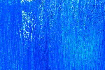 Background of iron painted with blue paint with streaks