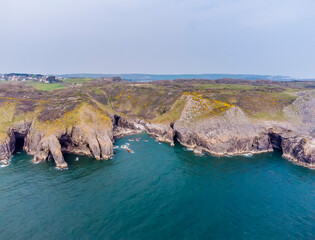 An panorama aerial view from sea along the Pembrokeshire coast near to Tenby, South Wales in springtime