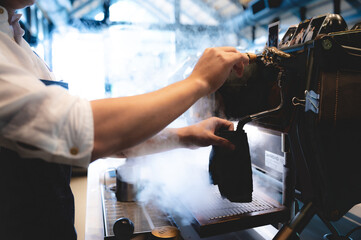 espresso coffee machine in cafe, professional barista making a hot drink caffeine with a cup on the bar in a shop or restaurant, modern coffee shop, brown cappuccino beverage maker