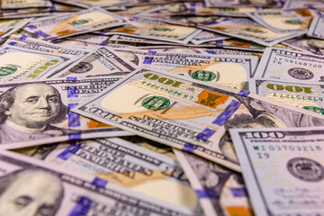 Background of one hundred dollar banknotes. Selective focus