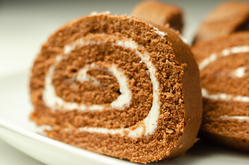Chocolate sponge roll with a vanilla flavour filling, chocolate swiss roll