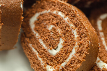 Chocolate sponge roll with a vanilla flavour filling, chocolate swiss roll
