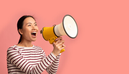 Announcement. Young Asian Lady With Megaphone In Hands Shouting At Copy Space