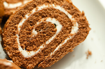 Chocolate sponge roll with a vanilla flavour filling, chocolate swiss roll