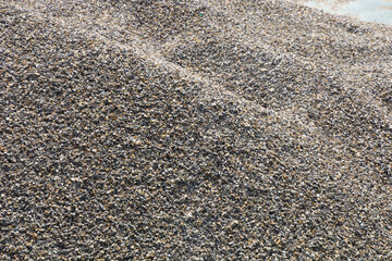 pile of small gravel stones on the construction site ready for use