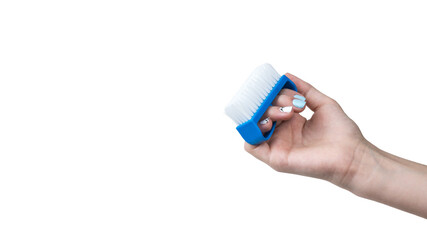 A woman's hand with a small brush isolated on a white background.