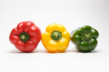 Red yellow green bell pepper isolated on white background