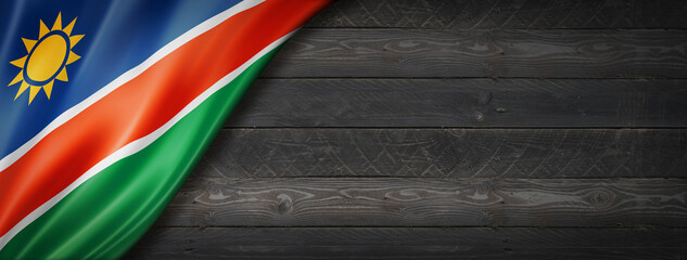 Namibian flag on black wood wall banner