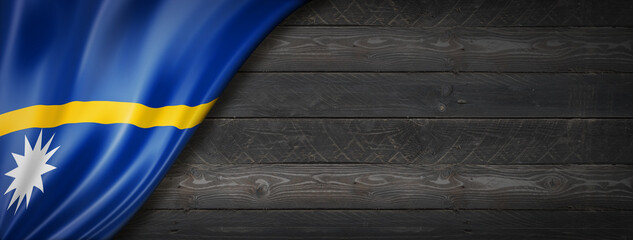 Nauru flag on black wood wall banner