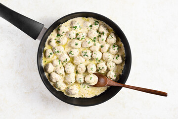 Swedish meatballs with white creamy sauce