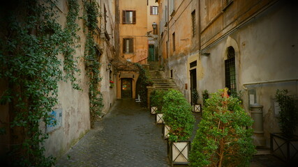 Fototapeta na wymiar Narrow Old Street In The City Of Rome