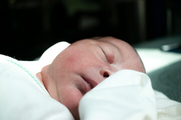 Newborn baby girl sleeping in his first days in world.