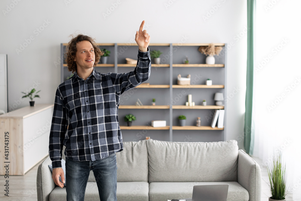 Poster Man Pointing Finger Up Pushing Button On Invisible Screen Indoors