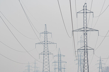 Power line poles in fire smoke 