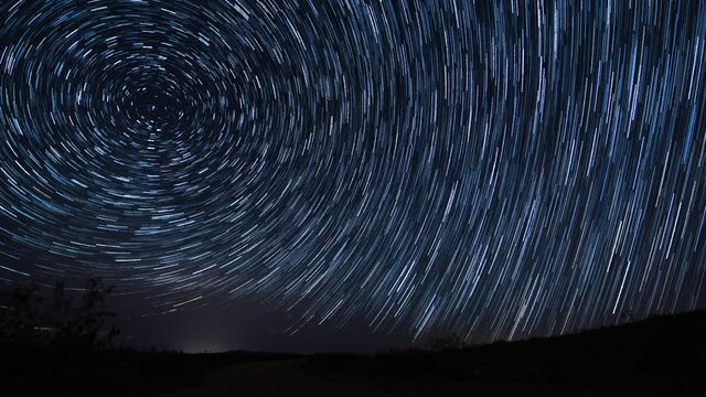Polaris North Star Startrails over Grassy Hill Spring Season Astrophotography Time Lapse