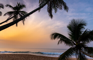 Naklejka na ściany i meble Beautiful sunrise over tropic beach