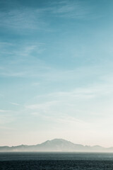 sea and sky with coast in dust