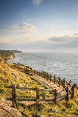 path along the coast cliff sunset