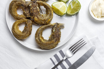 Typical Spanish frying of fried fish with lemon
