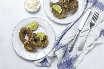 Typical Spanish frying of fried fish with lemon