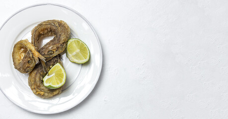 Typical Spanish frying of fried fish with lemon