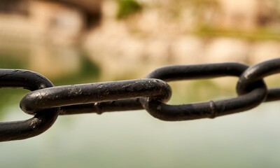 iron rusty chain hanging in the air