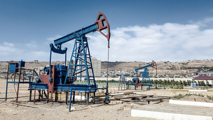 Oil pump jack on the outskirts of the city of Baku. Azerbaijan