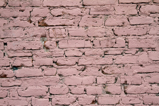 Background: Brick wall covered in pink paint	
