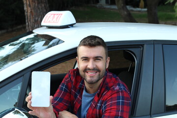 Driver showing mobile phone screen with a smile